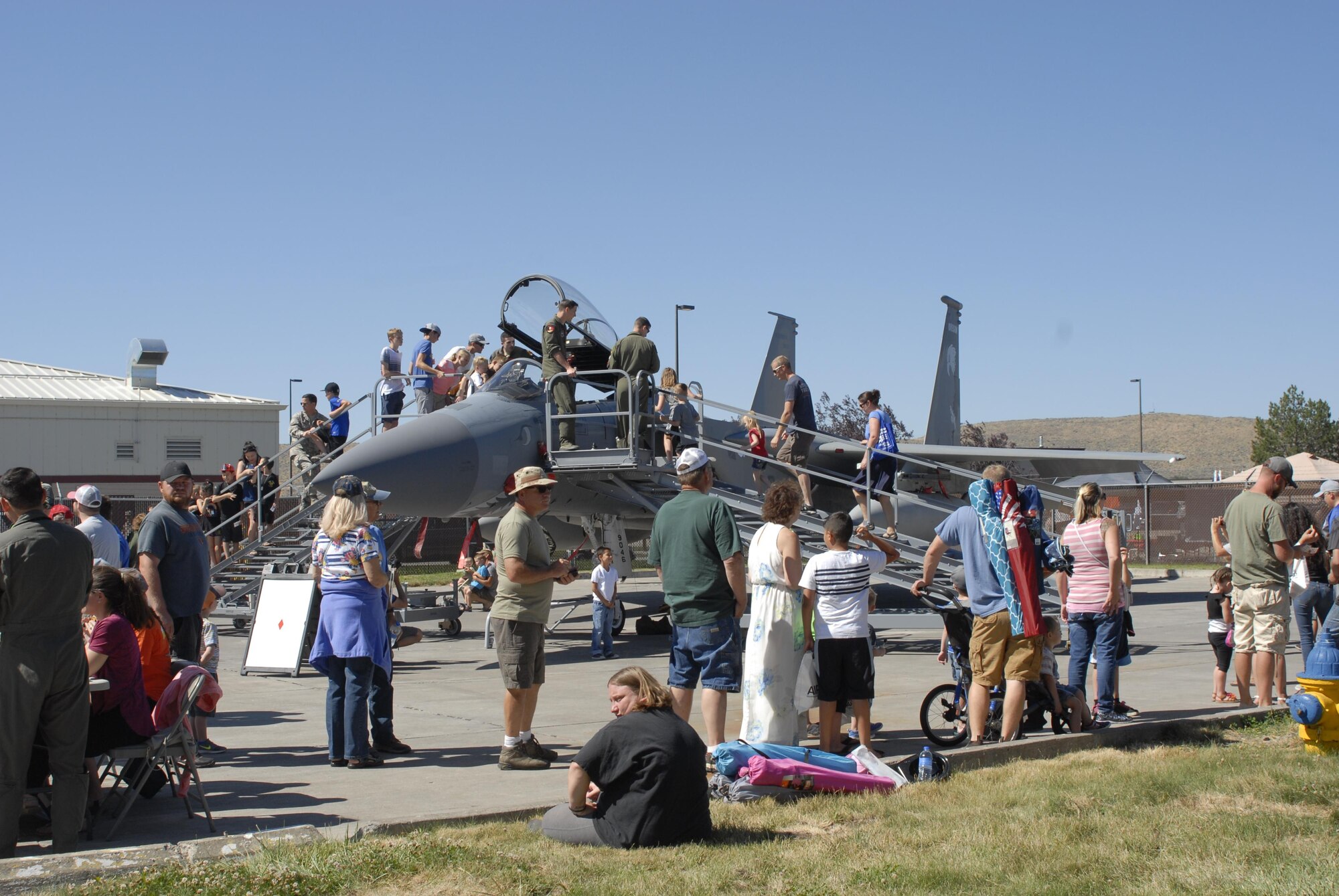 People crowd around a static display F-15 Eagle from the 173rd Fighter Wing during the Sentry Eagle Open House held July 22, 2017 at Kingsley Field in Klamath Falls, Oregon.  Sentry Eagle is a four day large force exercise that brings together different aircraft and units from around the country for dissimilar air combat training.  Additionally, the wing opens its gates to the public for a day during their biennial open house.  (U.S. Air National Guard photo by Master Sgt. Jennifer Shirar)