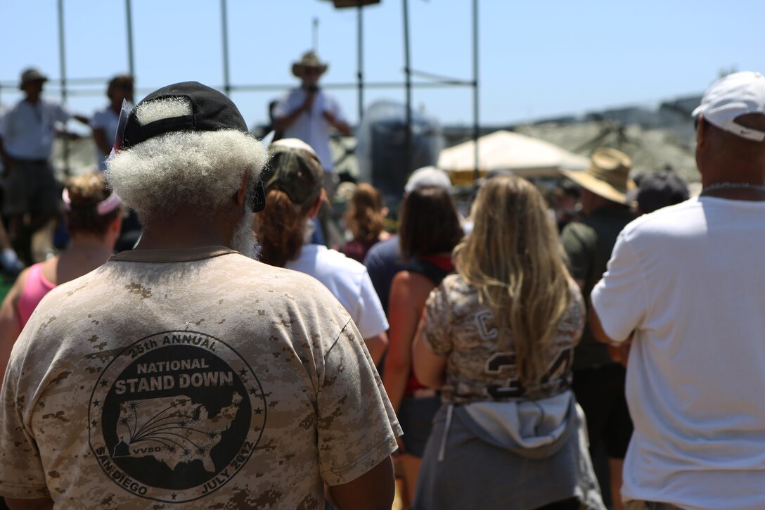 Veterans listen to a speech from Jon Nachison, co-founder of the Homeless Veteran Stand Down, during the 30th Annual Stand Down at San Diego High School in San Diego, July 21. Veterans Village of San Diego hosted the event July 19 to 21 to support San Diego’s homeless veterans by providing services such as medical and dental care, legal assistance, hygiene services, food and shelter during the stand down. (U.S. Marine Corps photo by Cpl. Daniel Auvert/Released)