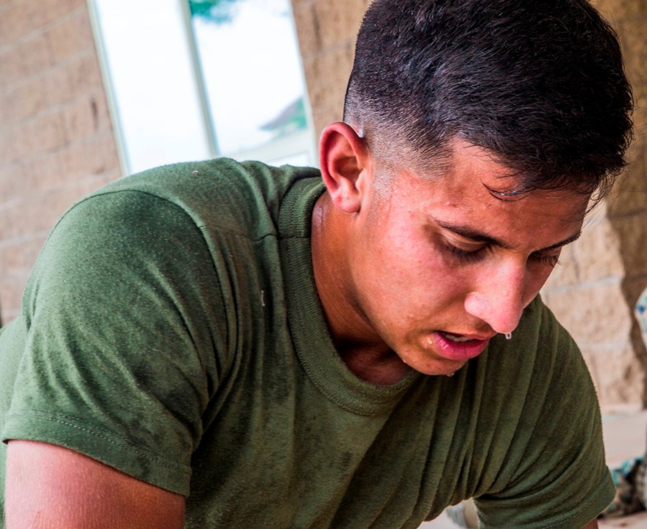 CAMP PENDLETON, Calif. – U.S. Marine Pfc. Mitchell Manuel, a field radio operator with Transportation Service Company, Combat Logistics Battalion 1, Combat Logistics Regiment 1, 1st Marine Logistics Group, recuperates after the practical application portion of a combat lifesaver course July 22, 2017. During a CLS course, Marines are put into a high-stress and intense environment aimed at heightening not only their war fighting skills, but also giving them a new skill set applying combat casualty care.  (U.S. Marine Corps Photo by Lance Cpl. Joseph Sorci)
