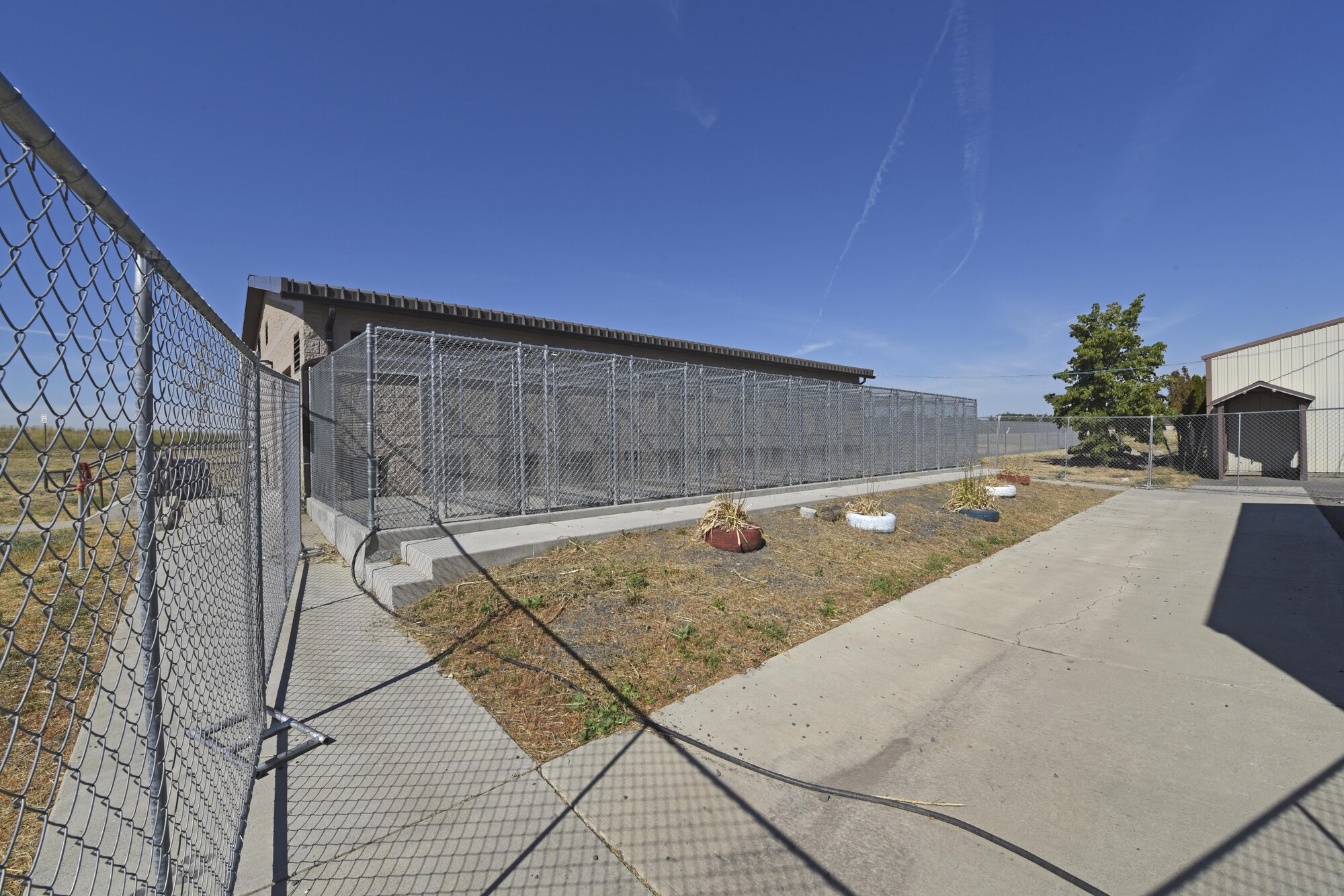 Construction for the 92nd Security Forces Squadron Military Working Dog kennels began in mid-July, breaking ground on the $1.7 million project. While construction is underway, the MWDs and handlers have relocated to Tanker Tails, a base kennel used for boarding and caring for family pets. (U.S. Air Force photo/Senior Airman Mackenzie Richardson)