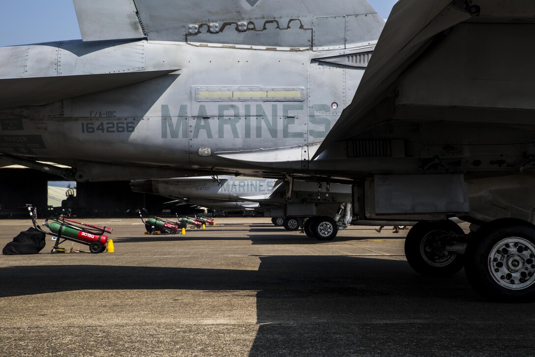 U.S. Marine Corps F/A-18C Hornets with Marine Fighter Attack Squadron (VMFA) 232 are fired up as they prepare to take off at Japan Air Self-Defense Force (JASDF) Hyakuri Air Base, Japan, July 10, 2017. VMFA-232 has been conducting exercises with the JASDF as part of the Aviation Training Relocation program, which is designed to increase operational readiness and interoperability between U.S. and Japanese forces. (U.S. Marine Corps photo by Lance Cpl. Mason Roy)