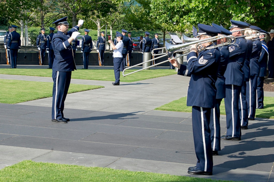 Argentine Air Force Chief of Staff Brig. Gen. Enrique Amrein participates in full honors ceremonies at the Air Force Memorial and Arlington National Cemetery as he arrives in Arlington, Va., Jul. 18, 2017. Here is the Ceremonial Brass, conducted by Captain Boothe.(U.S. Air Force photos/MSgt. Lee Osberry/released)