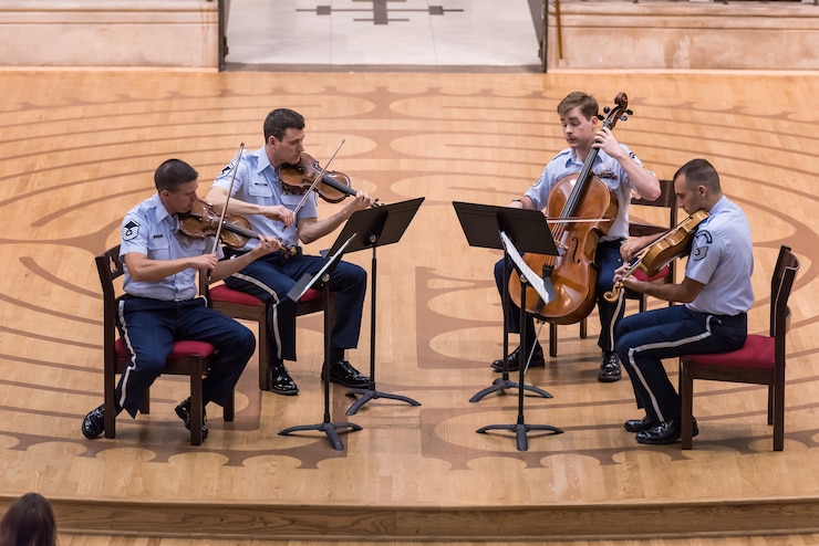 The Air Force String Quartet performs a patriotic lunchtime concert at the Church of the Epiphany on the 4th of July. They are one of many Air Force musical groups helping the public celebrate the nation's birthday today.