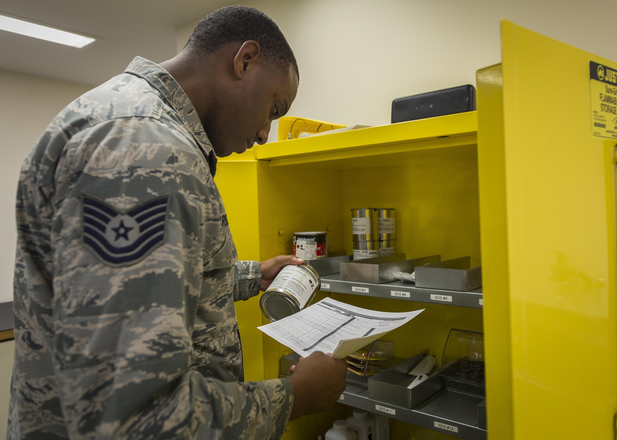 Tech. Sgt. Stephen Roberts, 339th Flight Test Squadron, Robins Air Force Base, Georgia, corrects write-ups for a Hazard communication program, July 18, 2017, at Yokota Air Base, Japan. The Hazcom program is intended to minimize the incidence of chemically induced occupational illnesses and injuries in the work area. (U.S. Air Force photo by Airman 1st Class Juan Torres)