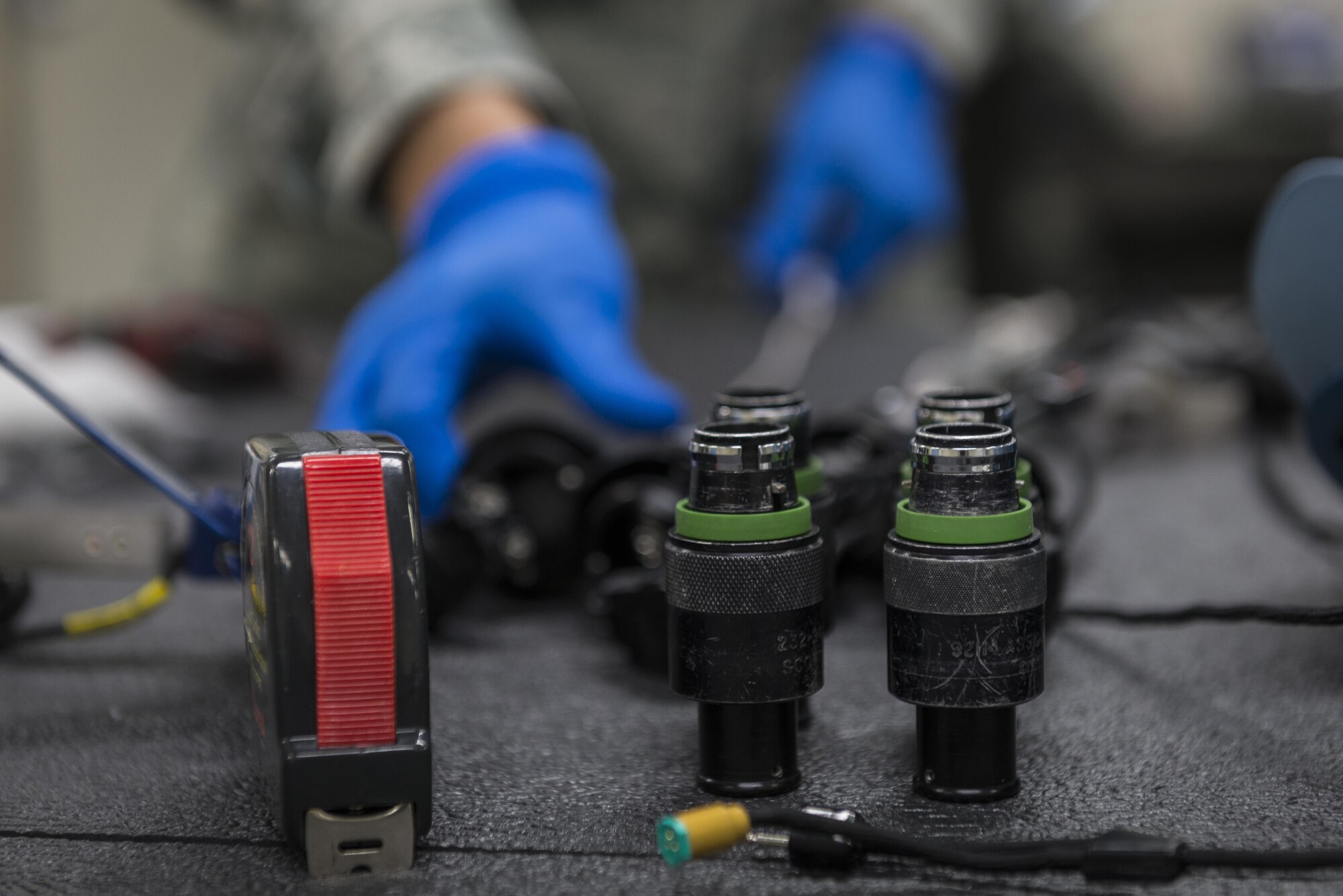 Tech. Sgt. Jacklyn Sugiyama, 120th Operations Support Squadron, Montana Air National Guard, builds quick-dawn masks, July 18, 2017, at Yokota Air Base, Japan. The equipment will be used on all of Yokota’s C-130J Super Hercules models. (U.S. Air Force photo by Airman 1st Class Juan Torres)