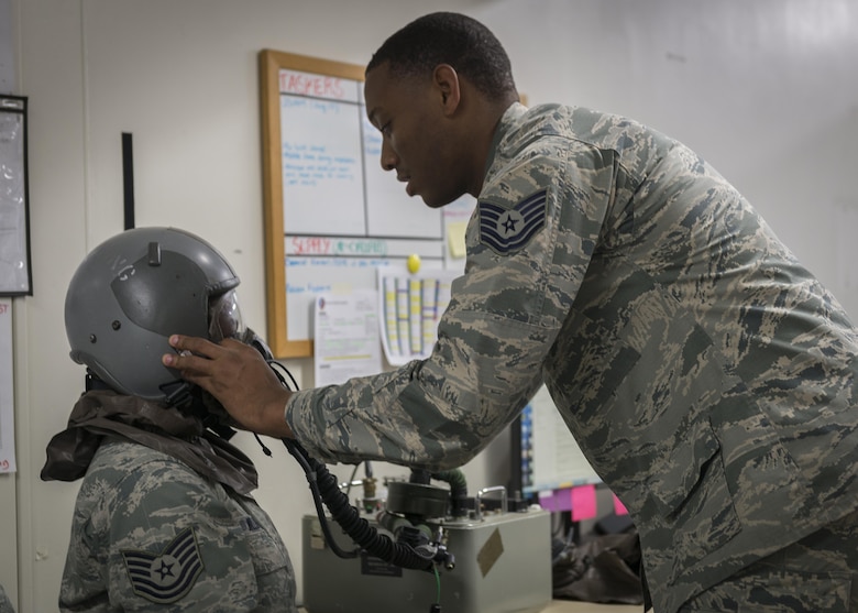 Tech. Sgt. Stephen Roberts, 339th Flight Test Squadron, Robins Air Force Base, Georgia, performs a mask leak test on Tech. Sgt. Shakuntala Willis, 374th Operations Support Squadron Aircrew Flight Equipment main shop NCO in charge, July 19, 2017, at Yokota Air Base, Japan. The leak test is used to verify the mask’s seal and integrity. (U.S. Air Force photo by Airman 1st Class Juan Torres)

