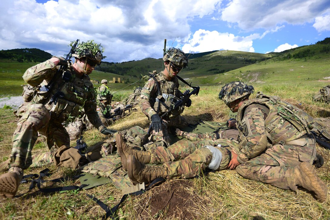 Paratroopers conduct tactical combat casualty care during a live-fire exercise as part of Exercise Rock Knight at Pocek Range in Postonja, Slovenia, July 25, 2017. Army photo by Davide Dalla Massara