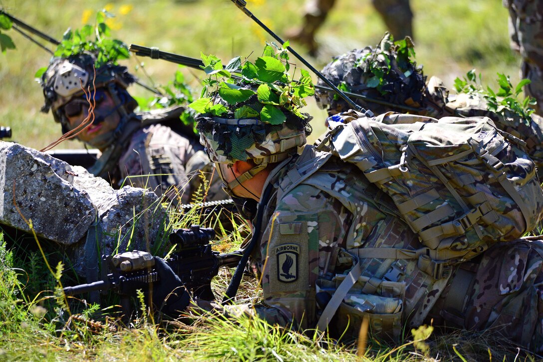Paratroopers communicate follow-on orders while engaging targets during a live-fire exercise as part of Exercise Rock Knight at Pocek Range in Postonja, Slovenia, July 25, 2017. Army photo by Paolo Bovo