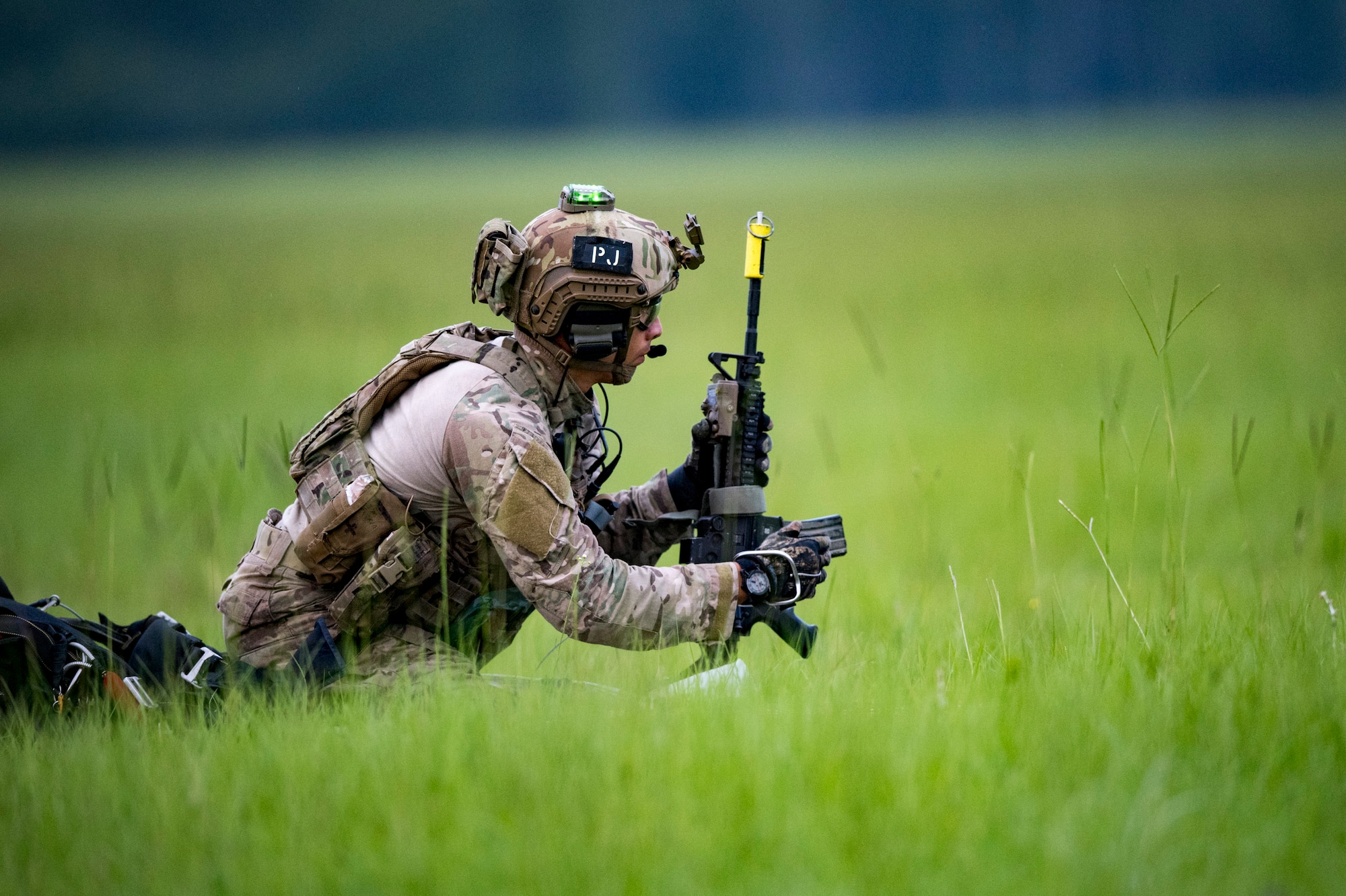 A Pararescueman from the 38th Rescue Squadron prepares his weapon during a rescue exercise, June 21, 2017, at Bemiss Field landing zone, Ga. The Air Force Research Laboratory from Wright-Patterson Air Force Base, Ohio and the Baltimore U.S. Air Force Center for Sustainment of Trauma and Readiness Skills, observed Moody's Combat Search and Rescue aeromedical patient processes and survival kit technology, in hopes of reducing risks to improve the overall Air Force mission. (U.S. Air Force photo by Airman 1st Class Daniel Snider)