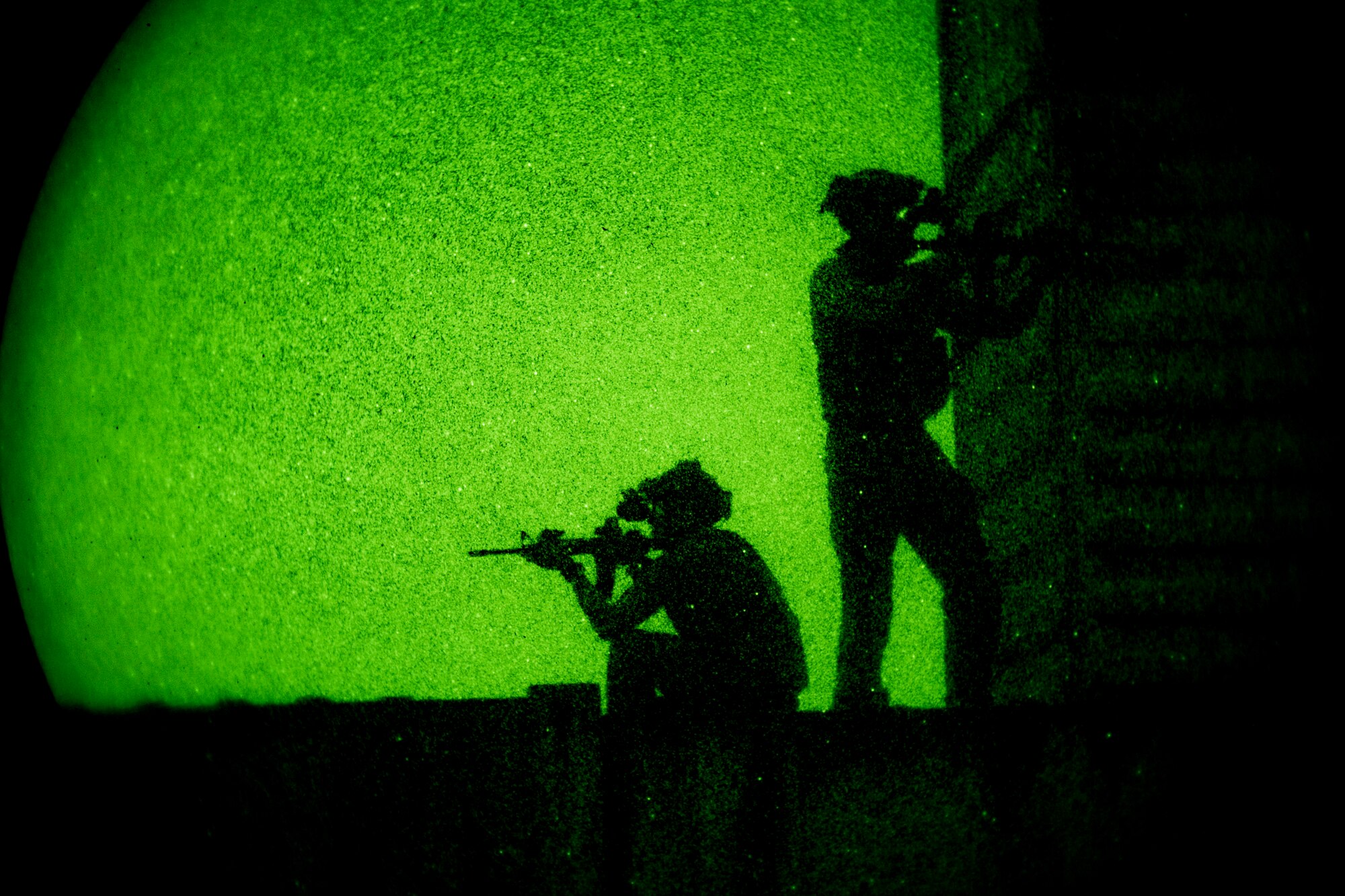 Pararescuemen from the 38th Rescue Squadron secure the perimeter under the cover of darkness during a rescue exercise, June 21, 2017, at Bemiss Field landing zone, Ga. The Air Force Research Laboratory from Wright-Patterson Air Force Base, Ohio and the Baltimore U.S. Air Force Center for Sustainment of Trauma and Readiness Skills, observed Moody's Combat Search and Rescue aeromedical patient processes and survival kit technology, in hopes of reducing risks to improve the overall Air Force mission. (U.S. Air Force photo by Airman 1st Class Daniel Snider)  