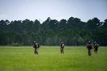Pararescuemen from the 38th Rescue Squadron travel towards the scenario location after parachuting into a rescue exercise, June 21, 2017, at Bemiss Field landing zone, Ga. The Air Force Research Laboratory from Wright-Patterson Air Force Base, Ohio and the Baltimore U.S. Air Force Center for Sustainment of Trauma and Readiness Skills, observed Moody's Combat Search and Rescue aeromedical patient processes and survival kit technology, in hopes of reducing risks to improve the overall Air Force mission. (U.S. Air Force photo by Airman 1st Class Daniel Snider)