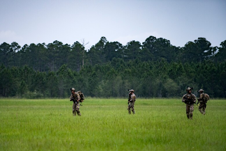 Pararescuemen from the 38th Rescue Squadron travel towards the scenario location after parachuting into a rescue exercise, June 21, 2017, at Bemiss Field landing zone, Ga. The Air Force Research Laboratory from Wright-Patterson Air Force Base, Ohio and the Baltimore U.S. Air Force Center for Sustainment of Trauma and Readiness Skills, observed Moody's Combat Search and Rescue aeromedical patient processes and survival kit technology, in hopes of reducing risks to improve the overall Air Force mission. (U.S. Air Force photo by Airman 1st Class Daniel Snider)