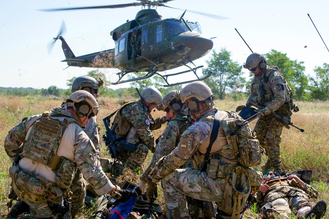 Hungarian special operations forces prepare to load a simulated casualty into a medical evacuation helicopter during exercise Black Swan in Szolnok, Hungary, July 21, 2017. Army photo by Staff Sgt. Aaron Duncan
