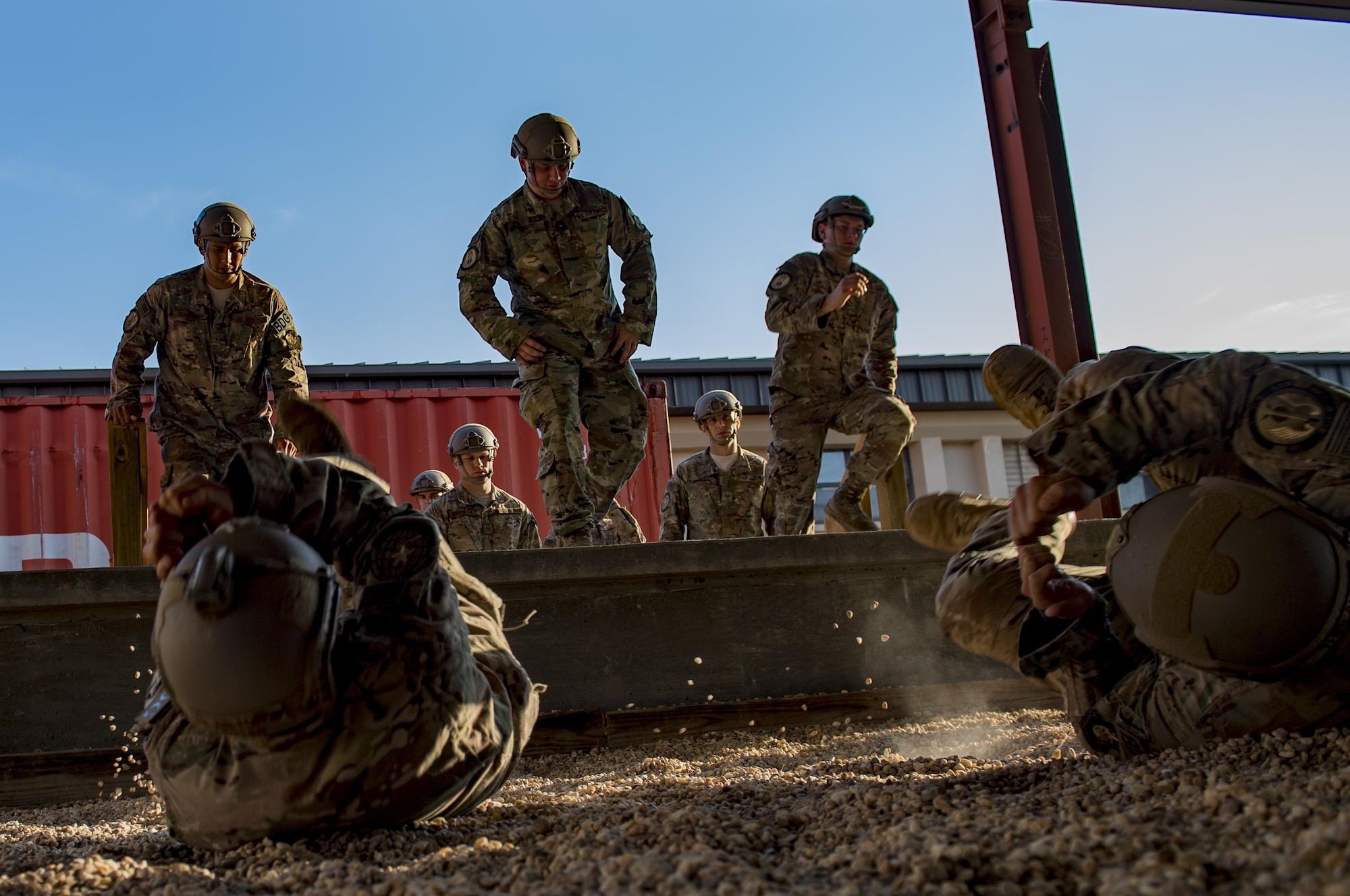 Airmen from the 820th Base Defense Group practice landing from a static-line jump, July 21, 2017, at Moody Air Force Base, Ga. This training was in preparation for an upcoming mission readiness exercise where airmen serve as an airborne advanced team, with the mission to create an initial presence and clear a path for follow-on forces to arrive on scene. (U.S. Air Force photo by Airman 1st Class Daniel Snider)