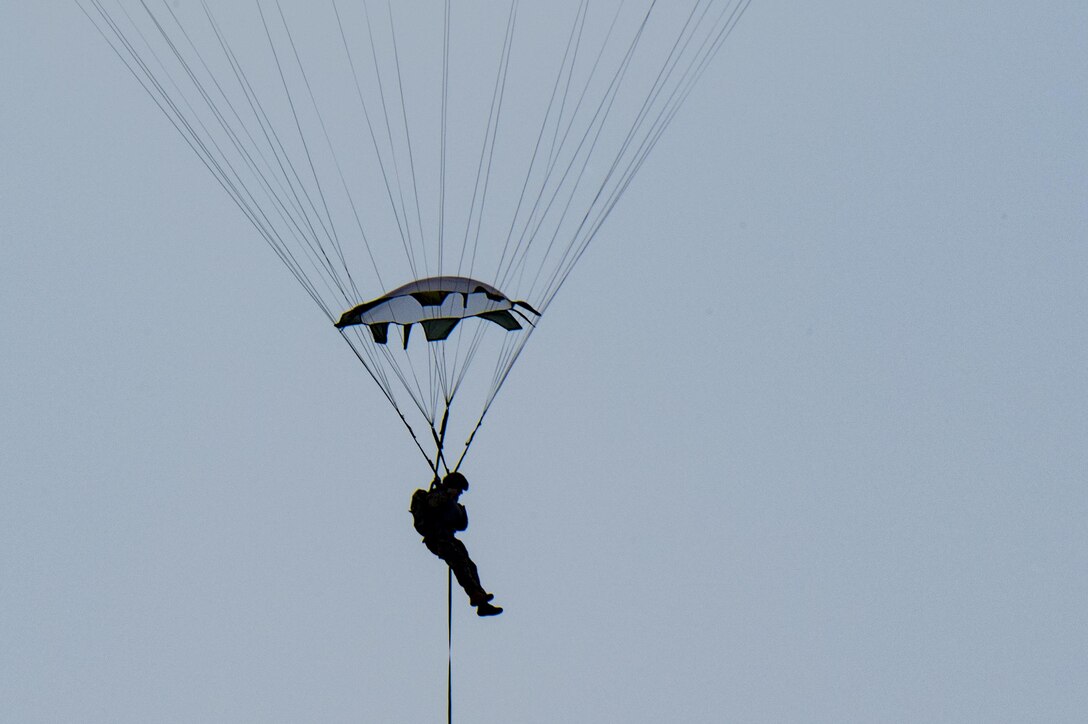 A member of the 823d Base Defense Squadron glides toward the ground, July 21, 2017, at the Lee Fulp Drop Zone in Tifton, Ga. This training was in preparation for an upcoming mission readiness exercise where airmen serve as an airborne advanced team, with the mission to create an initial presence and clear a path for follow-on forces to arrive on scene. (U.S. Air Force photo by Airman 1st Class Daniel Snider)