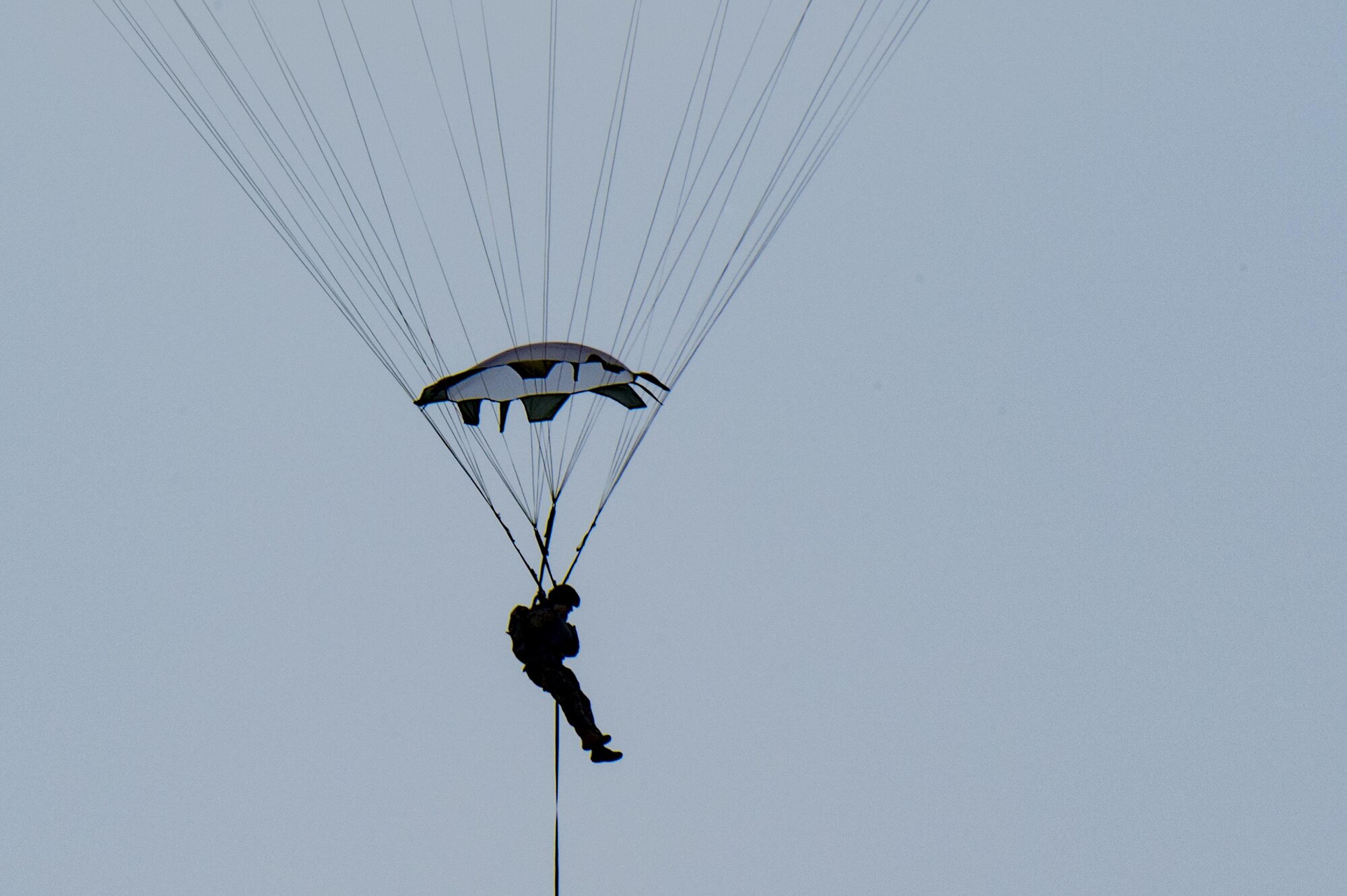 A member of the 823d Base Defense Squadron glides toward the ground, July 21, 2017, at the Lee Fulp Drop Zone in Tifton, Ga. This training was in preparation for an upcoming mission readiness exercise where airmen serve as an airborne advanced team, with the mission to create an initial presence and clear a path for follow-on forces to arrive on scene. (U.S. Air Force photo by Airman 1st Class Daniel Snider)