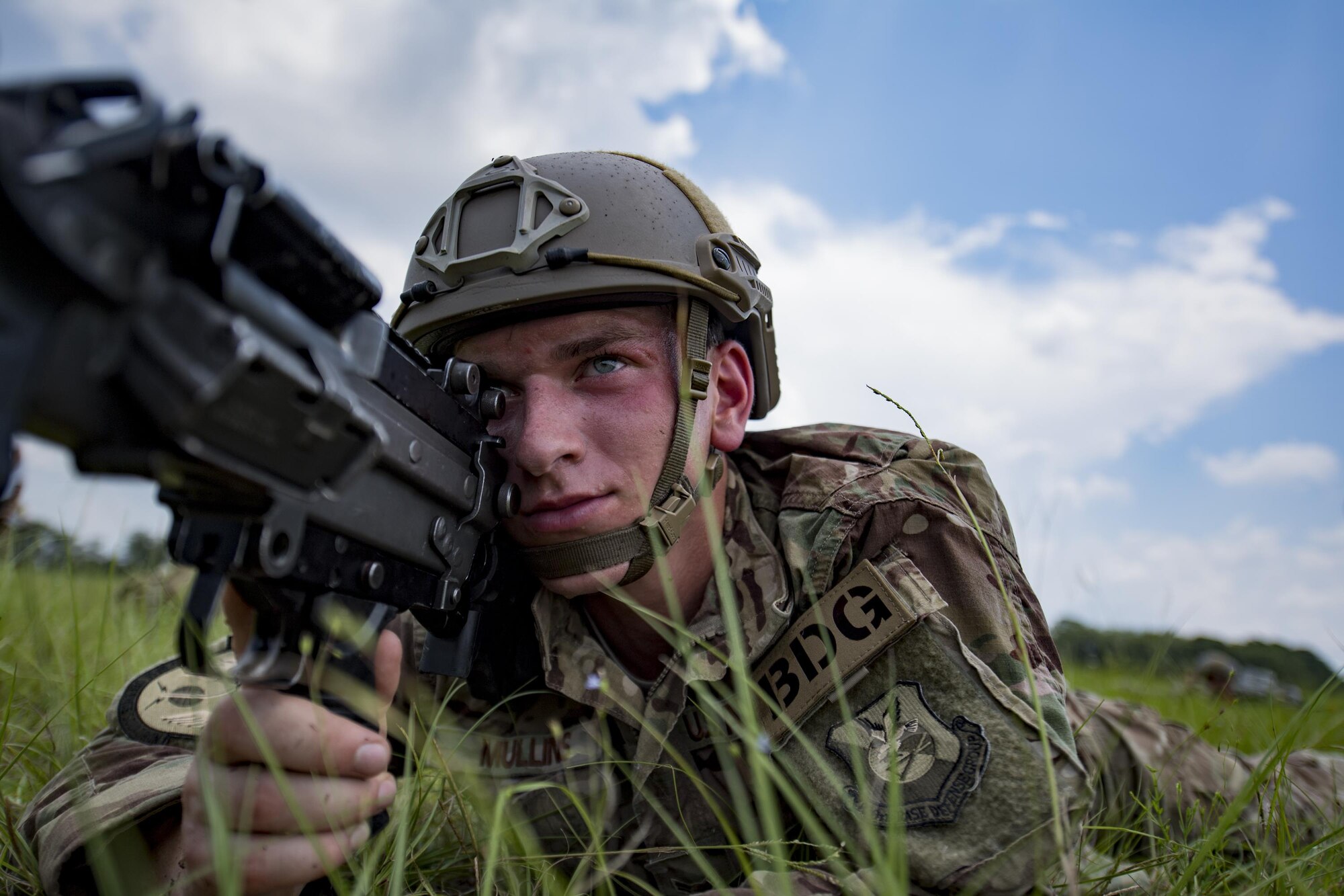 Airman 1st Class Sean Mullins, 823d Base Defense Squadron fire team member, secures a perimeter, July 21, 2017, at the Lee Fulp Drop Zone in Tifton, Ga. This training was in preparation for an upcoming mission readiness exercise where airmen serve as an airborne advanced team, with the mission to create an initial presence and clear a path for follow-on forces to arrive on scene. (U.S. Air Force photo by Airman 1st Class Daniel Snider)