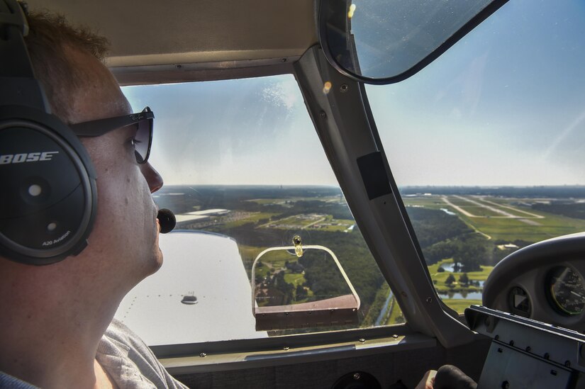 Maj. Ron Johnson, 437th Operations Support Squadron assistant director of operations, circles the airport before landing in Savannah, Ga., July 22, 2017. When Johnson's not flying for the 437th, he uses his personal plane and volunteer time to fly dogs from across the country to foster families and non-kill shelters for the Pilots N’ Paws program.