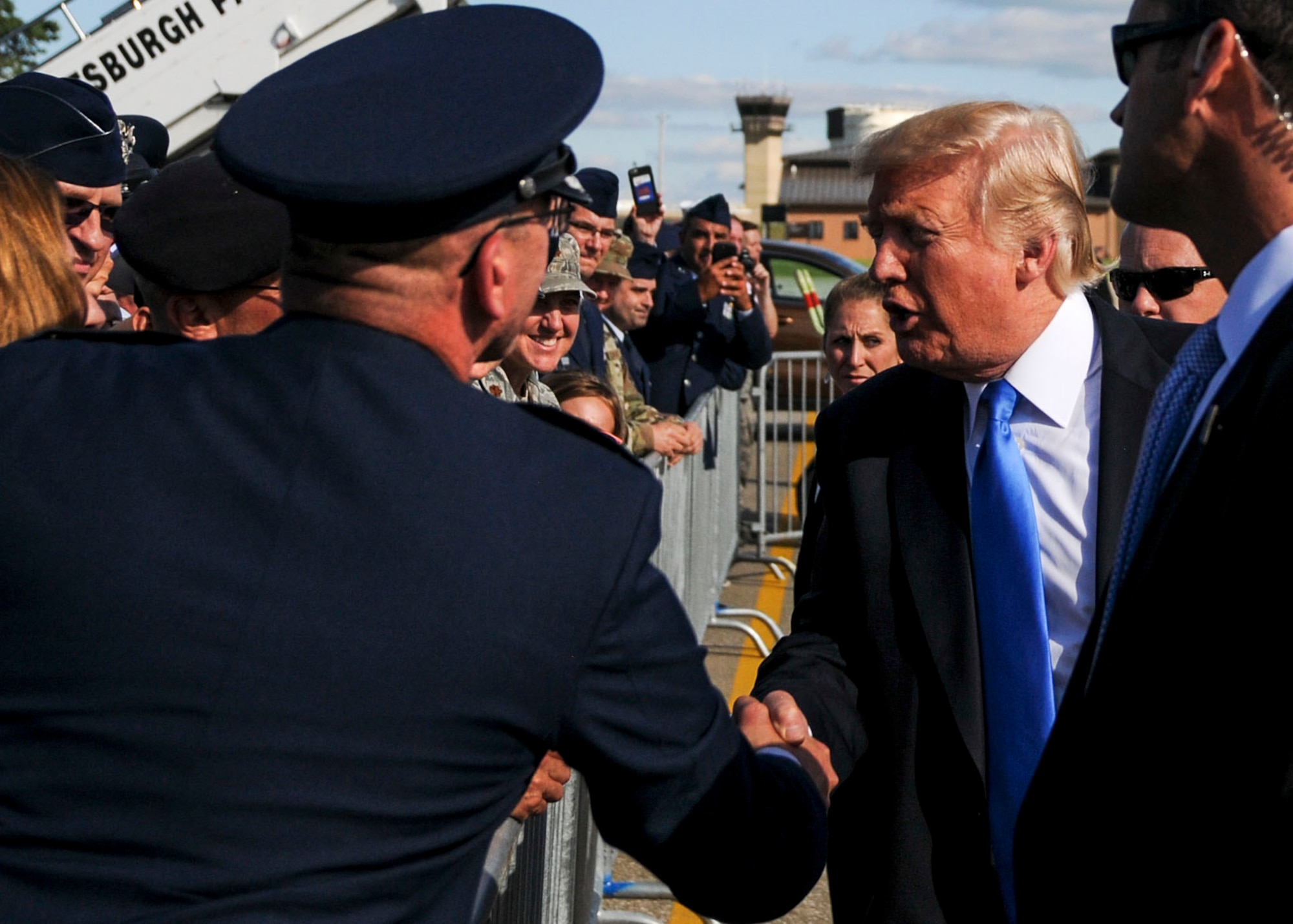 President Donald Trump shakes the hand of U.S. Air Force Reserve Col. David Post, 910th Airlift Wing Maintenance Group commander, while talking to Service members here, July 25, 2017. Trump greeted Service members and guests before departing the station to attend events in and around the Youngstown, Ohio area. (U.S. Air Force photo/Senior Airman Jeffrey Grossi)