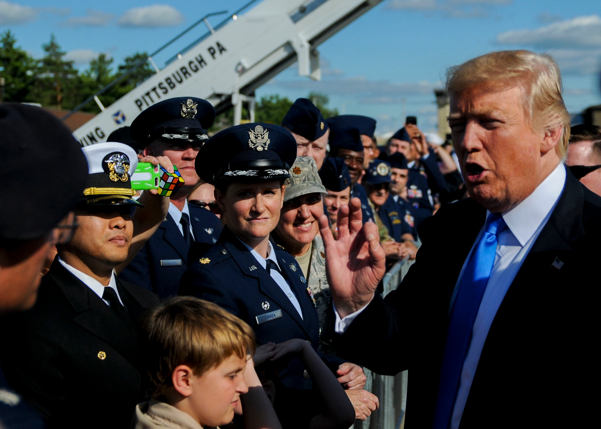 U.S. President Donald Trump talks with Citizen Airmen, Sailors and Marines assigned here, along with other guests, during a visit July 25, 2017. Trump landed at YARS prior to attending events in and around Youngstown. (U.S. Air Force photo/Senior Airman Jeffrey Grossi)