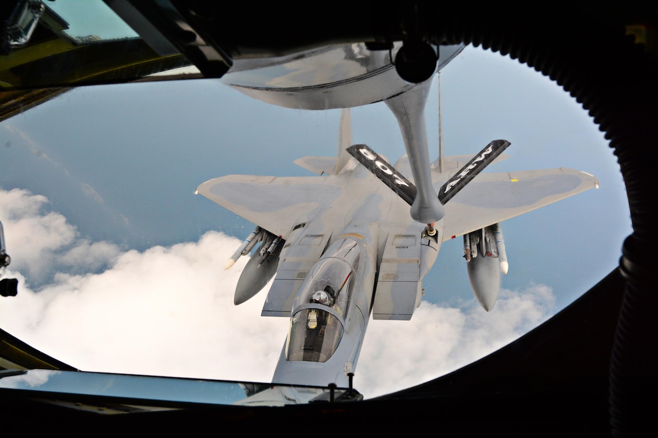 Reserve Citizen Airmen from the 465th Air Refueling Squadron at Tinker Air Force Base, Okla., deliver fuel to an F-15 Eagle assigned to RAF Lakenheath, England, July 19, 2017. In a long-standing partnership between the Air Force Reserve Command and U.S. Air Forces in Europe, members of the 507th Air Refueling Wing are augmenting the 100th Air Refueling Wing July 1-29, 2017, to provide KC-135R air refueling support to the European theater of operations. (U.S. Air Force photo/Tech Sgt. Lauren Gleason)