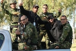 Team Colombia, the returning champions from last year's Fuerzas Comando competition, return to camp after completing the second marksmanship event at Vista Alegre in Presidente Hayes, Paraguay, July 18, 2017. U.S. Army photo by Spc. Elizabeth Williams