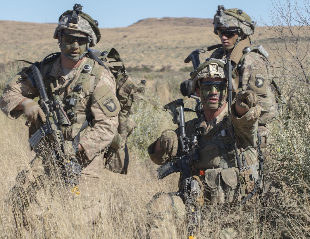 Army Staff Sgt. Donovan Sweet, a squad leader with the 101st Airborne Division's 2nd Battalion, 327th Infantry Regiment, gives orders to his squad while being attacked by mock insurgents during situational training for Shared Accord 17 at the South African Army Combat Training Center in Lohatla, July 21, 2017. The two-week exercise, which ends Aug. 3, enhances the peacekeeping capabilities of U.S. and African forces. DoD photo by Sean Kimmons