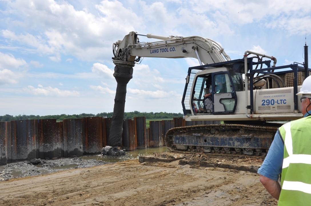 Marshy soil is being mixed with concrete and water to create a strong foundation for a levee as part of the  Port Monmouth Flood Risk Management Project in Port Monmouth, New Jersey. 