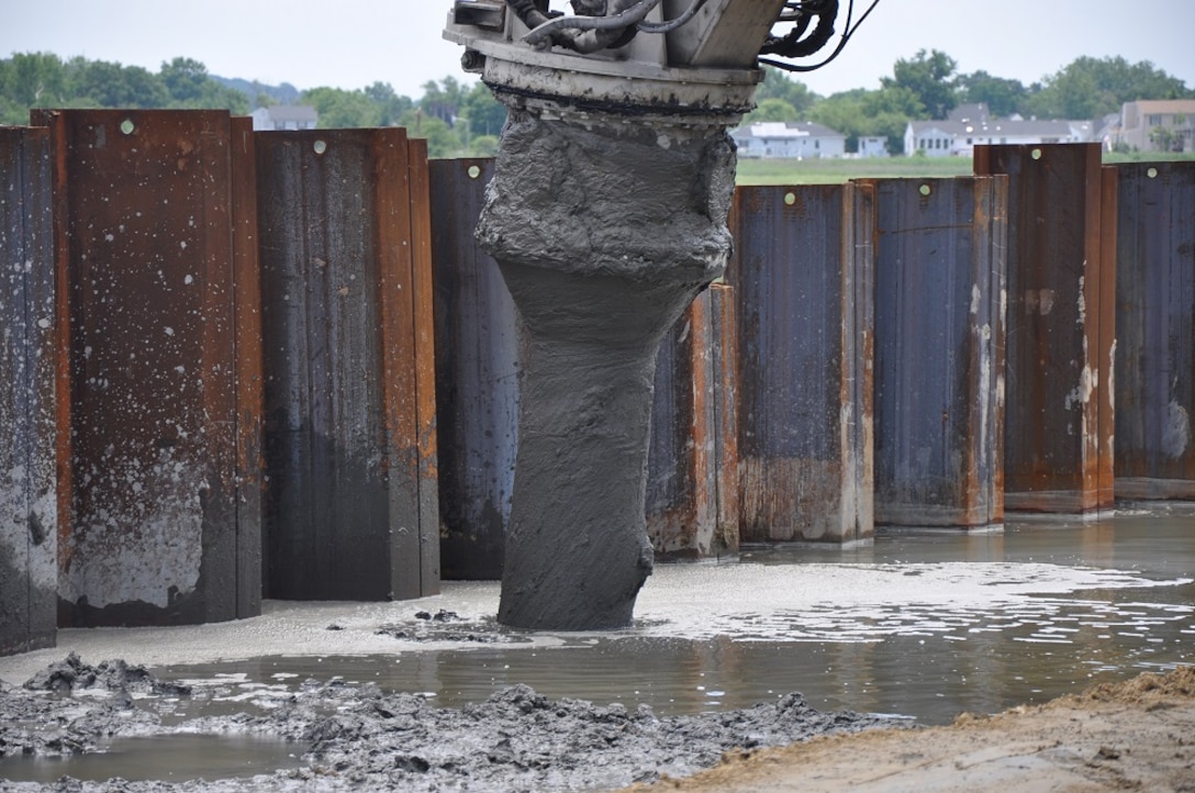 Marshy soil is being mixed with concrete and water to create a strong foundation for a levee as part of the  Port Monmouth Flood Risk Management Project in Port Monmouth, New Jersey. 