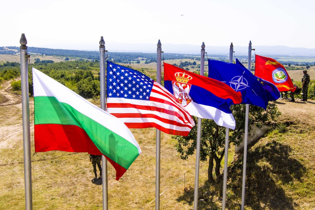 Flags at a training area in Koren, Bulgaria, reflect the nations and organizations participating in exercise Peace Sentinel, a combined-arms live-fire exercise between the Bulgarian Land Forces' 4th Infantry Division and the U.S. Army's 10th Combat Aviation Brigade, July 19, 2017. Peace Sentinel is a Bulgarian national exercise taking place as part of Saber Guardian 17. Army photo by Spc. Thomas Scaggs