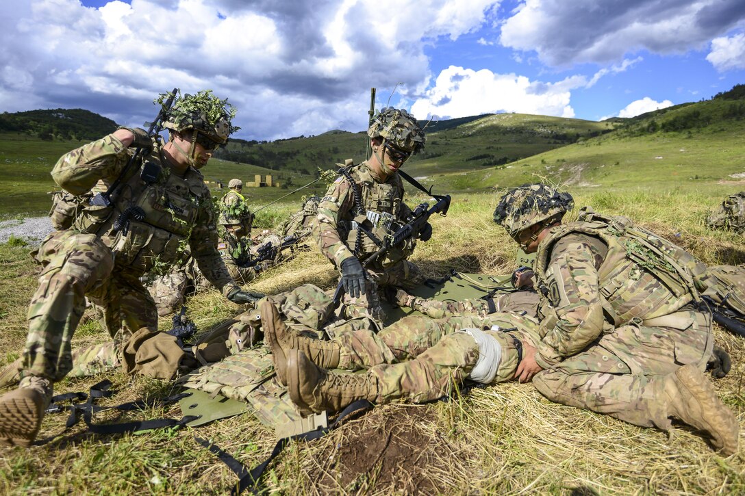 Soldiers conduct tactical combat casualty care during a live-fire exercise as part of Exercise Rock Knight at Pocek Range in Postojna, Slovenia, July 25, 2017. Exercise Rock Knight is a bilateral training exercise between the U.S. Army’s 173rd Airborne Brigade and the Slovenian Armed Forces focusing on small-unit tactics and enhancing readiness. Army photo by Davide Dalla Massara