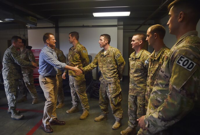 Lt. Gov. of South Carolina Kevin Bryant, left, thanks 628th Civil Engineer Squadron explosive ordnance disposal team Airmen for their service, during a visit here July 26. Bryant toured Joint Base Charleston to meet and thank military and civilian first responders for their service to the country and their efforts to support the local community. Bryant toured a C-17 Globemaster III, the installation fire department and received hands-on equipment familiarization from 628th CES EOD team Airmen. (U.S. Air Force photo by Staff Sgt. Christopher Hubenthal)