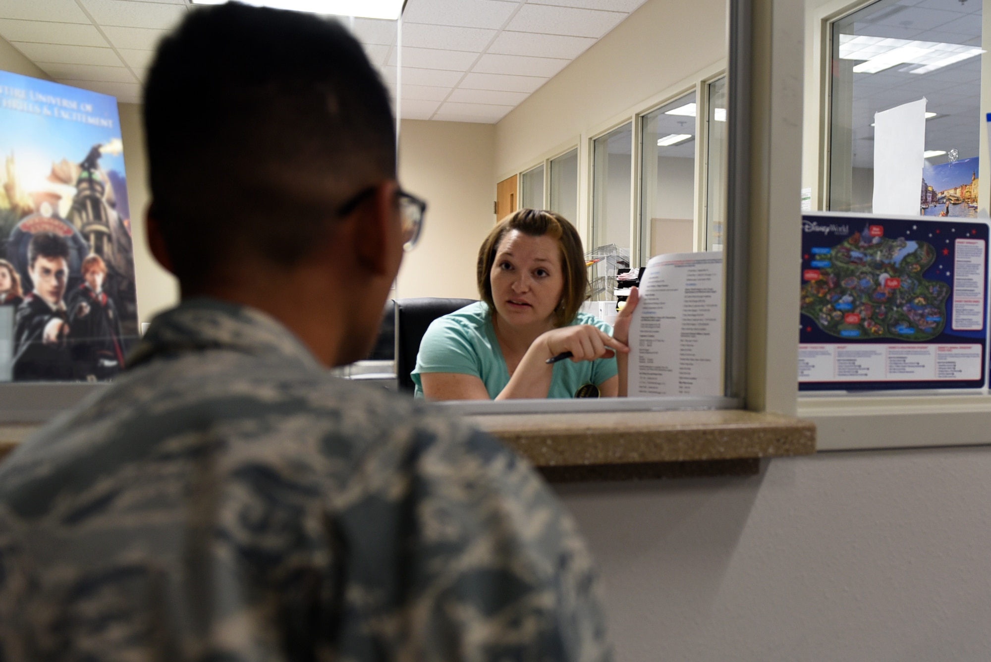 Andrea Hammock, 19th Force Support Squadron community center programmer assists Airman 1st Class Kevin Ly, 714th Training Squadron C-130J loadmaster apprentice, find a travel destination July 24, 2017, at the Walters Community Support Center on Little Rock Air Force Base, Ark. The Information, Tickets and Travel service is free and available to all of the Little Rock AFB populace. (U.S. Air Force photo by Airman 1st Class Kevin Sommer Giron)