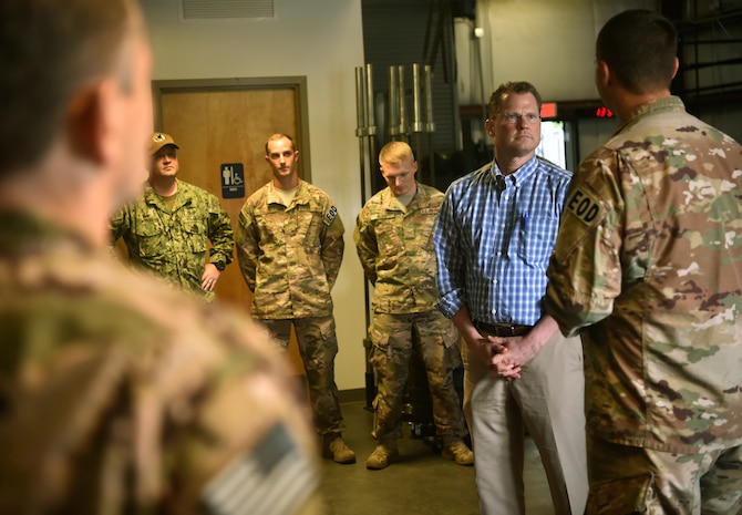 Lt. Gov. of South Carolina Kevin Bryant, right, talks with 628th Civil Engineer Squadron explosive ordnance disposal team Airmen, during a visit here July 26. Bryant toured Joint Base Charleston to meet and thank military and civilian first responders for their service to the country and their efforts to support the local community. Bryant toured a C-17 Globemaster III, the installation fire department and received hands-on equipment familiarization from 628th CES EOD team Airmen. (U.S. Air Force photo by Staff Sgt. Christopher Hubenthal)