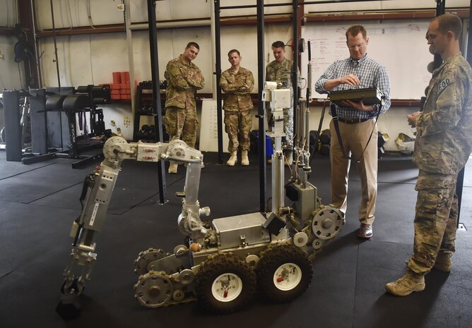 Lt. Gov. of South Carolina Kevin Bryant, right, operates a robot alongside 628th Civil Engineer Squadron explosive ordnance disposal team Airmen, during a visit here July 26. Bryant toured Joint Base Charleston to meet and thank military and civilian first responders for their service to the country and their efforts to support the local community. Bryant toured a C-17 Globemaster III, the installation fire department and received hands-on equipment familiarization from 628th CES EOD team Airmen. (U.S. Air Force photo by Staff Sgt. Christopher Hubenthal)