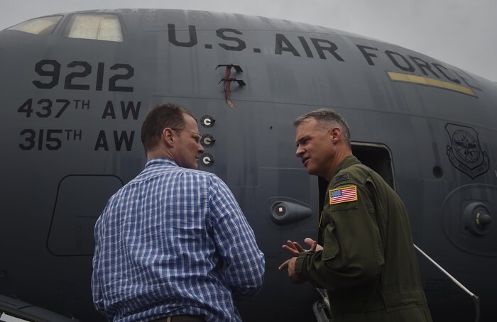 Lt. Gov. of South Carolina Kevin Bryant, left, talks to Col. Stephen Lanier, right, 315th Operations Group commander, during a tour of a C-17 Globemaster III as part of a visit here, July 26. Bryant toured Joint Base Charleston to meet and thank military and civilian first responders for their service to the country and their efforts to support the local community. Bryant toured a C-17 Globemaster III, the installation fire department and received hands-on equipment familiarization from 628th Civil Engineer Squadron explosive ordinance disposal team Airmen. (U.S. Air Force photo by Staff Sgt. Christopher Hubenthal)