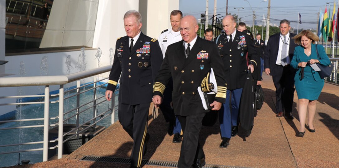 ASUNCIÓN, Paraguay (July 24, 2017)-- U.S. Navy Adm. Kurt W. Tidd, commander of U.S. Southern Command, and U.S. Special Operations Command commander, Army Gen. Raymond Thomas III, talk while en route to the Fuerzas Comando 2017 Senior Leader Seminar opening ceremony in Asunción, Paraguay. Both leaders were in Paraguay to participate in the seminar, observe the competition and discuss defense ties with Paraguay’s armed forces. (Photo by Jose Ruiz, SOUTHCOM Public Affairs)