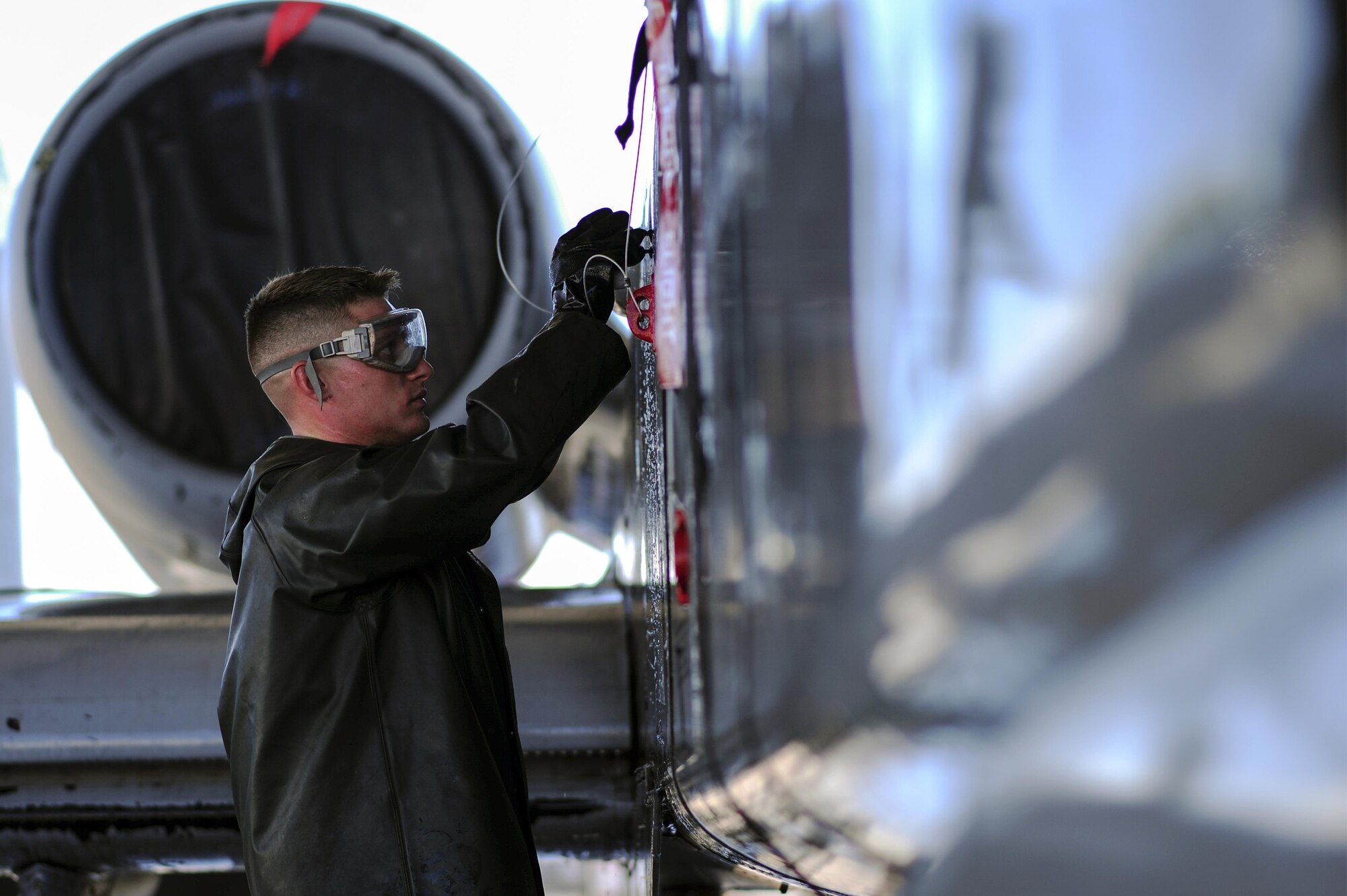 U.S. Air Force Airman 1st Class Jacob Mitchell, 354th Aircraft Maintenance Unit airframe power plant general crew chief, washes an A-10C Thunderbolt II at Davis-Monthan Air Force Base, Ariz., July 25, 2017. The A-10 is washed every six months to prevent buildup and corrosion. (U.S. Air Force photo by Airman 1st Class Michael X. Beyer)