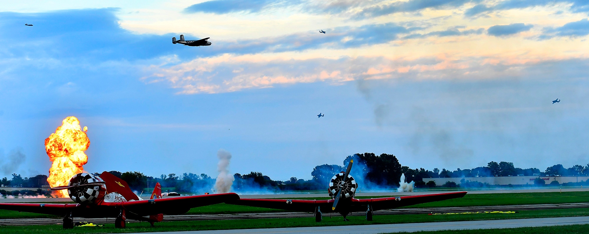 Multiple B-25s simulate the Doolittle Raid on Tokyo at the Experimental Aircraft Association's AirVenture 2017 night show in Oshkosh, Wisc., July 26, 2017. (U.S. Air Force photo/Scott M. Ash)