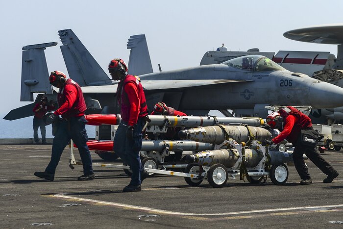 Sailors move ordnance aboard the aircraft carrier USS Nimitz in the Arabian Gulf, July 25, 2017. The Nimitz is supporting Operation Inherent Resolve in the U.S. 5th Fleet area of operations. Navy photo by Petty Officer 3rd Class Ian Kinkead