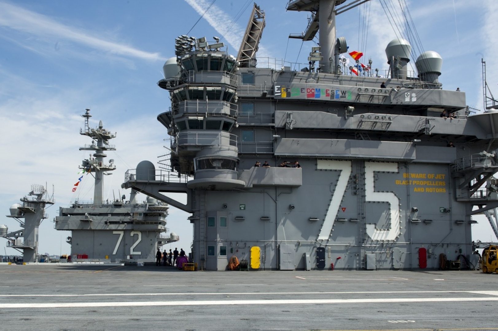 NORFOLK (July 25, 2017) The superstructures of the aircraft carriers USS Harry S Truman (CVN 75), right, and USS Abraham Lincoln (CVN 72) are close together during Harry S Truman's transit into port. Harry S Truman returned to Naval Station Norfolk following the successful completion of a four-day sea trials evolution.