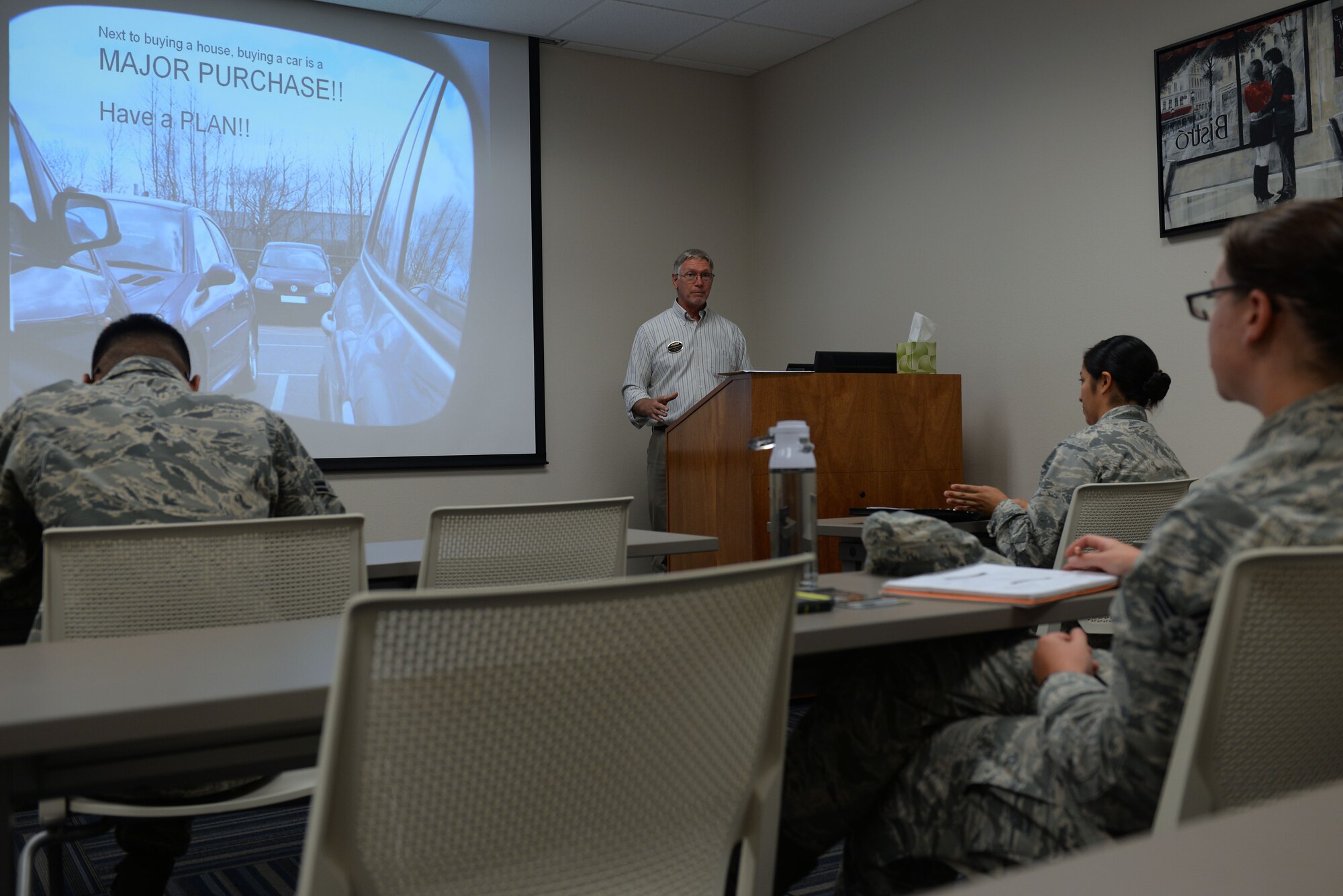 Richard Tomaskovic, 19th Force Support Squadron community readiness consultant, teaches the Car Buying class July 25, 2017, at Little Rock Air Force Base, Ark. Tomaskovic teaches a variety of classes focused on finances at the Airmen and Family Readiness Center. (U.S. Air Force photo by Airman Rhett Isbell)