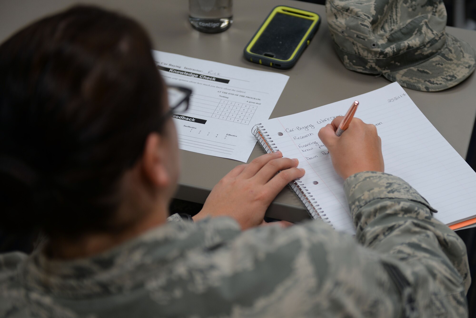 Senior Airman Amanda Block, 19th Operations Support Squadron enlisted executive assistant, writes notes during the Car Buying class at the Airmen and Family Readiness Center July 25, 2017, at Little Rock Air Force Base, Ark. The classes offered at the Airmen and Family Readiness Center are free for all Airmen and their families. (U.S. Air Force photo by Airman Rhett Isbell)