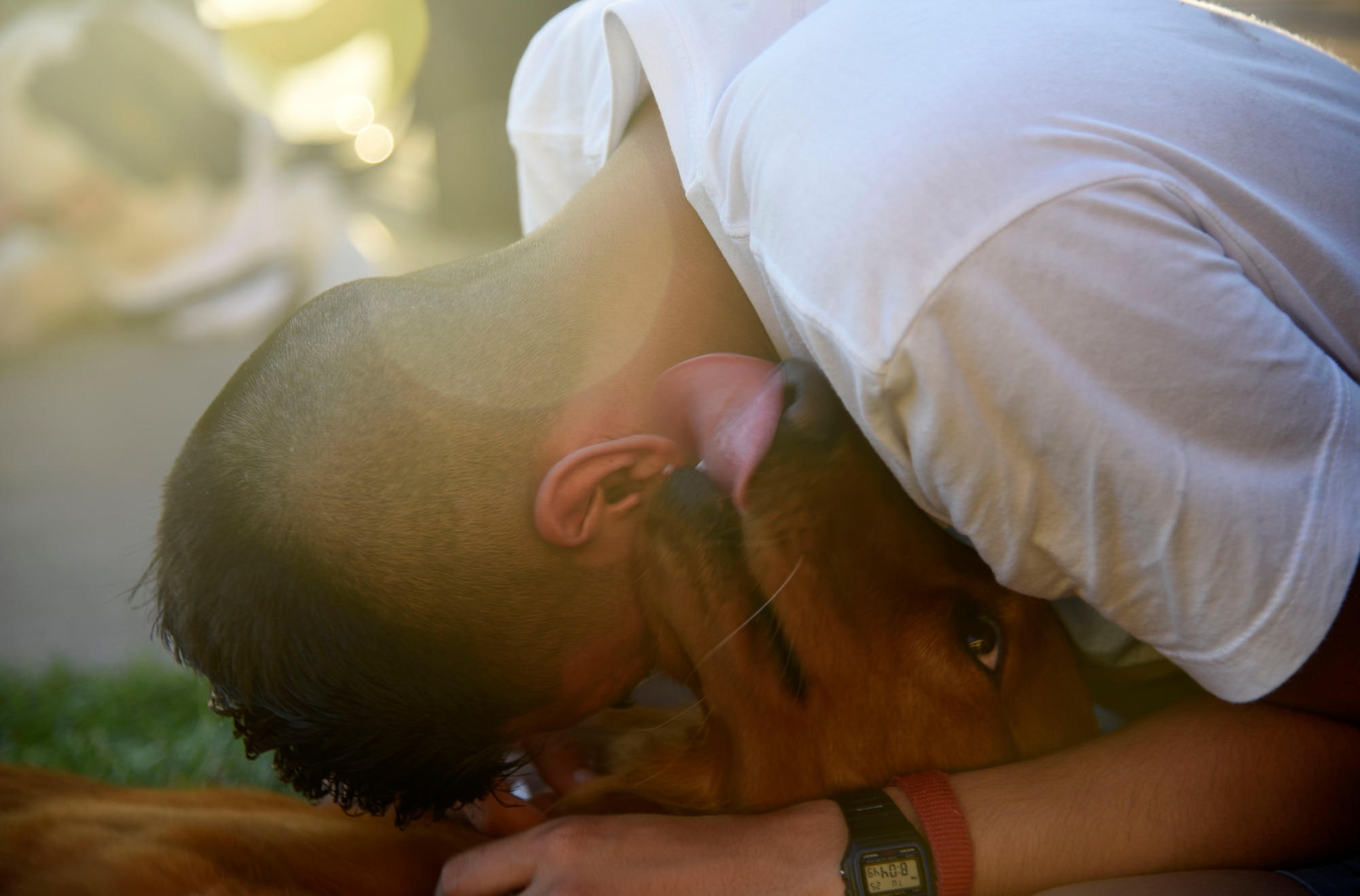 Airman Brandon Mena, 22nd Maintenance Squadron aerospace propulsion technician, interacts with a therapy dog July 25, 2017, at McConnell Air Force Base, Kan. Since Airmen living in the dorms aren’t permitted to have animals, therapy dogs and their owners from Love on a Leash visited to share some puppy love. (U.S. Air Force photo/Airman 1st Class Erin McClellan)