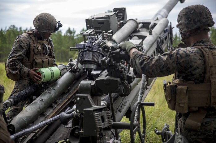 Marines load a charge into an M777A2 Howitzer during a live-fire range at Camp Lejeune, N.C., July 26, 2017. The purpose of this field operation is to test and improve the unit’s capabilities by putting the Marines into a simulated combat environment. The Marines are with 1st Battalion, 10th Marine Regiment. (U.S. Marine Corps photo by Lance Cpl. Holly Pernell)