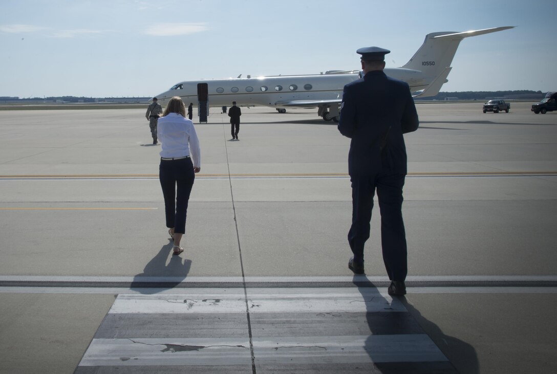 Katie Maynard, 89th Airlift Wing flight line protocol specialist (left), walks out to the flight line to greet an arriving distinguished visitor June 22, 2017, at Joint Base Andrews, Md. Airmen of the 89th AW flight line protocol office support more than 43,000 foreign and domestic dignitaries and staff. The Airmen also support approximately 3,500 distinguished visitor missions yearly. 