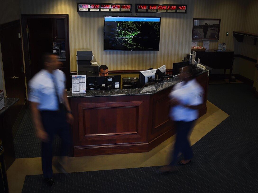 Airmen of the 89th Airlift Wing flight line protocol office walk busily around the Distinguished Visitor’s Lounge on Joint Base Andrews, Md., July 27, 2017. These Airmen directly support the president, vice president, first lady, Secretary of Defense, Secretary of State, Chairman of the Joint Chiefs of Staff, and foreign dignitaries. (U.S. Air Force photo illustration by Senior Airman Mariah Haddenham)