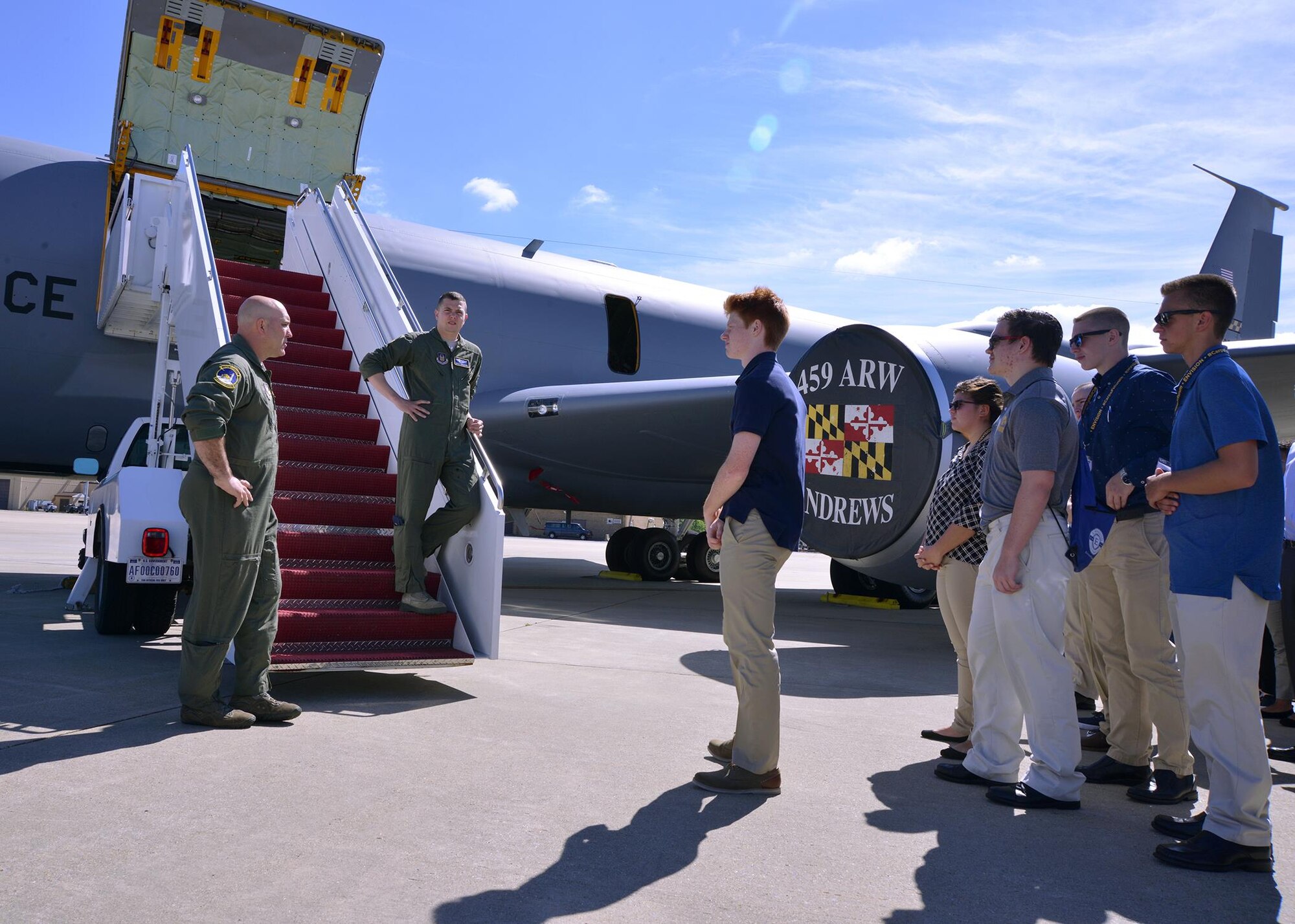 Tech. Sgt. Chris McAllister, 756th Air Refueling Squadron boom operator (left), and 1st Lt. Kyle Swenson, 756 ARS pilot (middle), speak to high school students during a career camp tour on the Joint Base Andrews, Maryland, flightline July 25, 2017. The students visited the 459th Air Refueling Wing to learn about careers available to them in the Air Force Reserve. (U.S. Air Force photo/Tech. Sgt. Erica Knight)