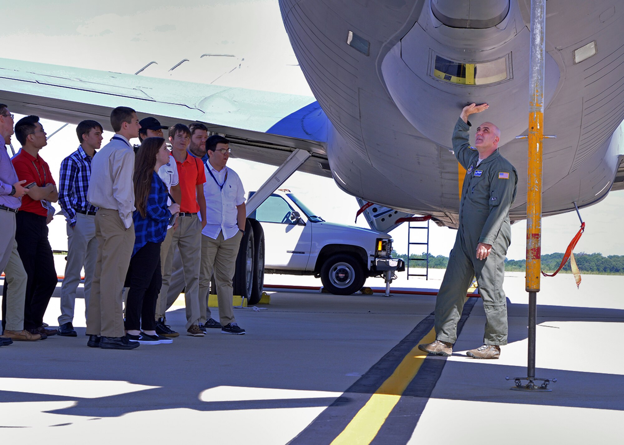 Tech. Sgt. Chris McAllister, 756th Air Refueling Squadron boom operator, speaks to high school students during a career camp tour on the Joint Base Andrews, Maryland, flightline July 25, 2017. The students visited the 459th Air Refueling Wing to learn about careers available to them in the Air Force Reserve. (U.S. Air Force photo/Tech. Sgt. Erica Knight)