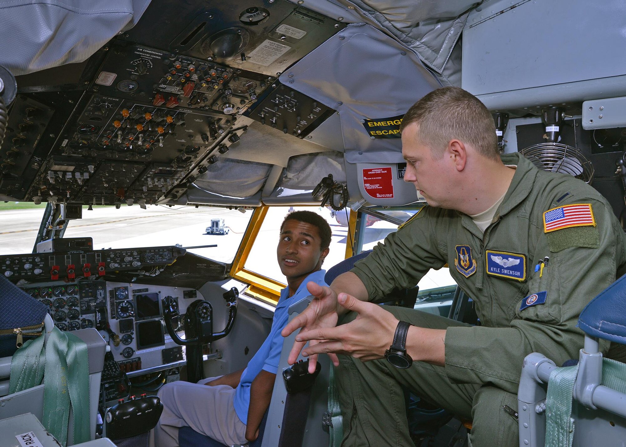 1st Lt. Kyle Swenson, 756th Air Refueling Squadron pilot, speaks to a career camp student about what it’s like to be a pilot inside a KC-135 Stratotanker on the Joint Base Andrews, Maryland, flightline July 25, 2017. The high-school age students visited the 459th Air Refueling Wing to learn about careers available to them in the Air Force Reserve. (U.S. Air Force photo/Tech. Sgt. Erica Knight)